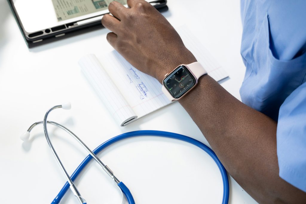 A doctor's left arm is seen.