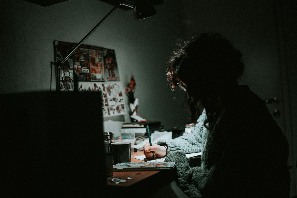 A person is on her computer, working.