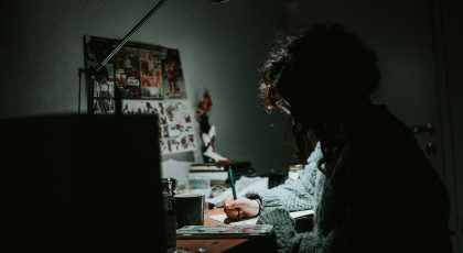 A person is on her computer, working.