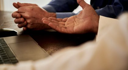 Two people seem to be talking with only their hands shown