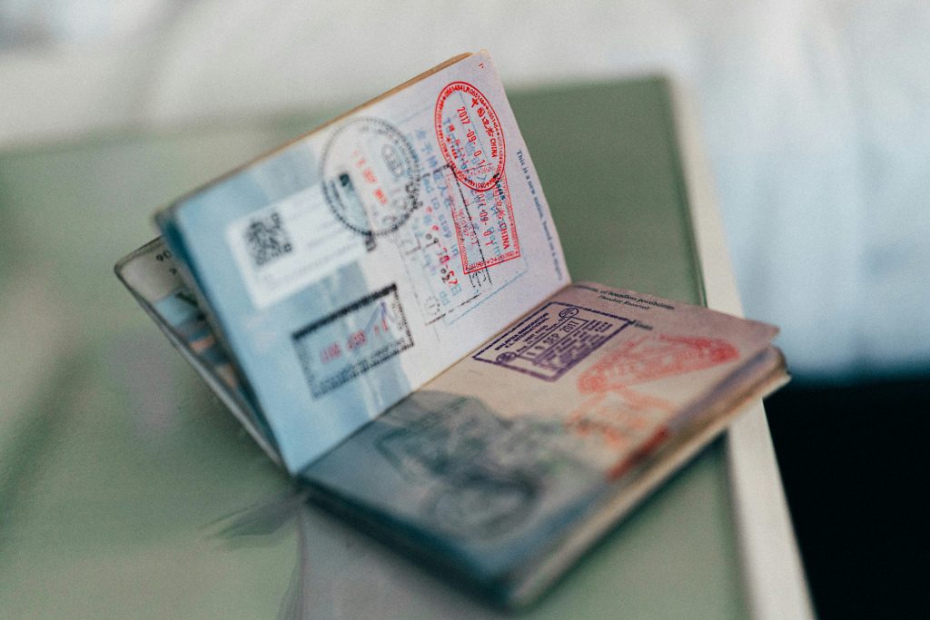 An open passport with a visa stamp on it