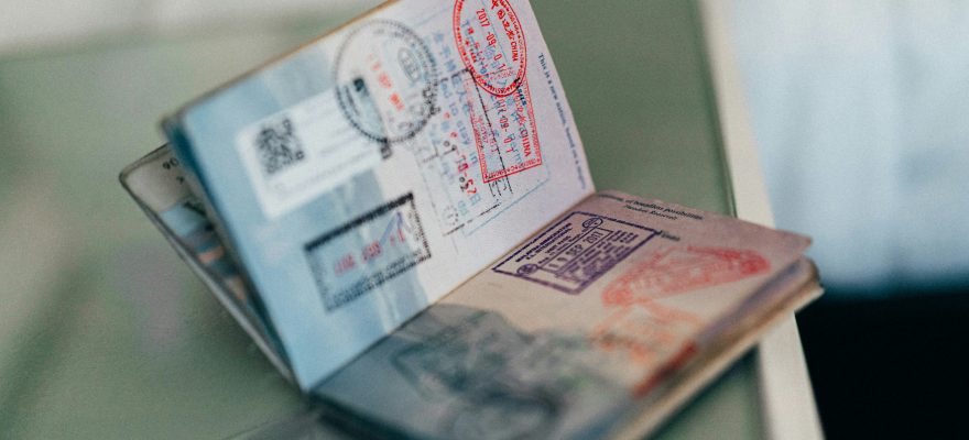 An open passport with a visa stamp on it