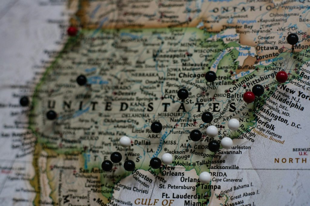 A USA map with pins showing the prominent states and cities.