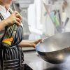 A chef with a large bowl in her hands.