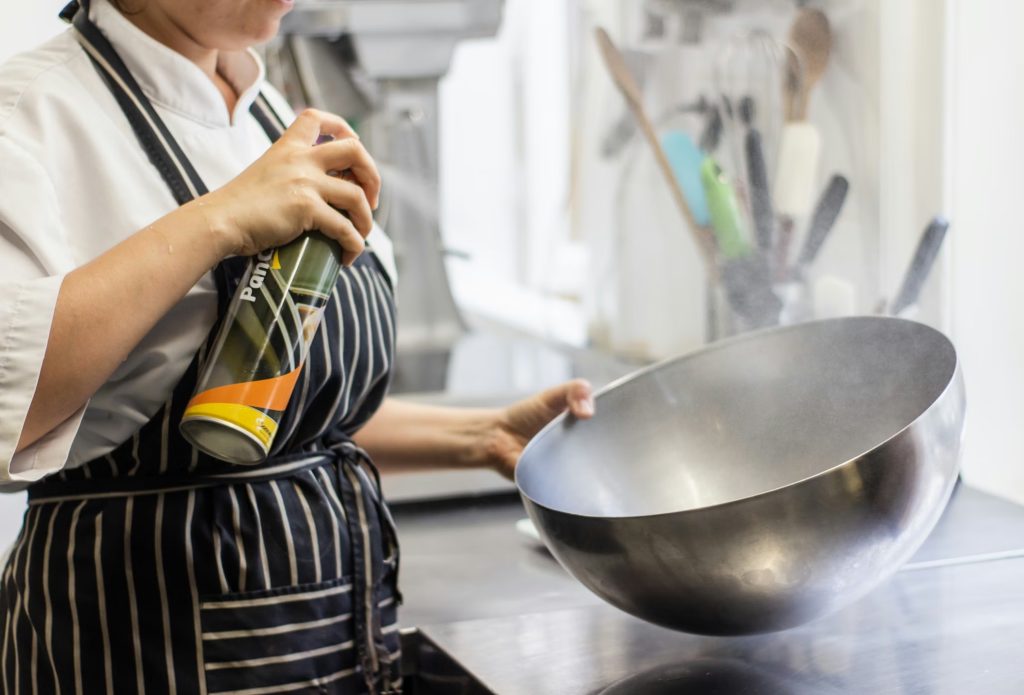 A chef with a large bowl in her hands.