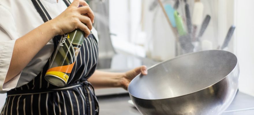 A chef with a large bowl in her hands.