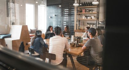 A group of people in a meeting room.